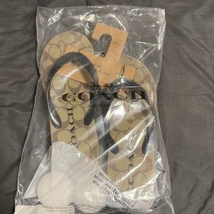 Coach platform flip flops.